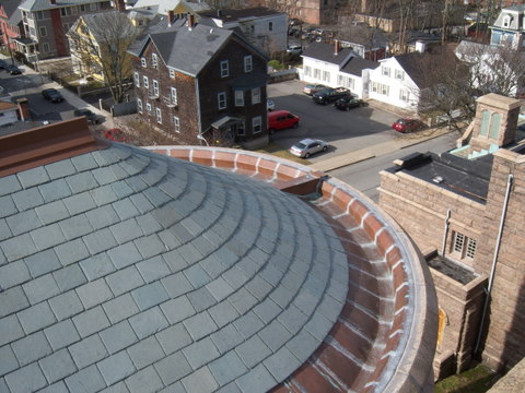 Slate and copper replacement of round turret.